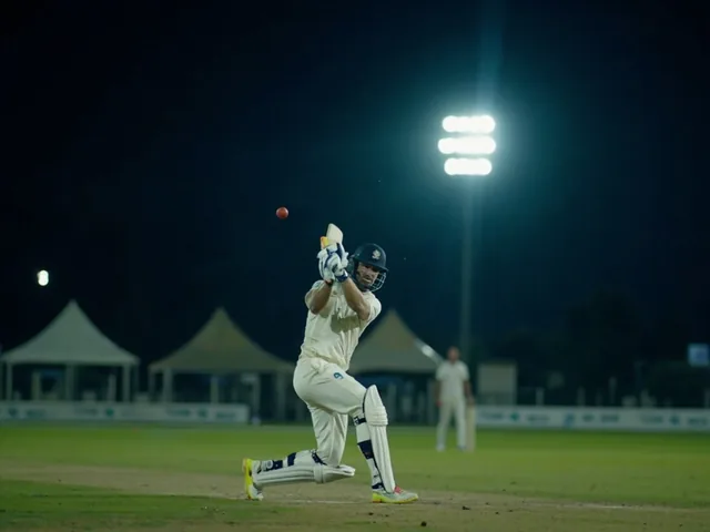 Cricket batsman hitting cover drive at night stadium